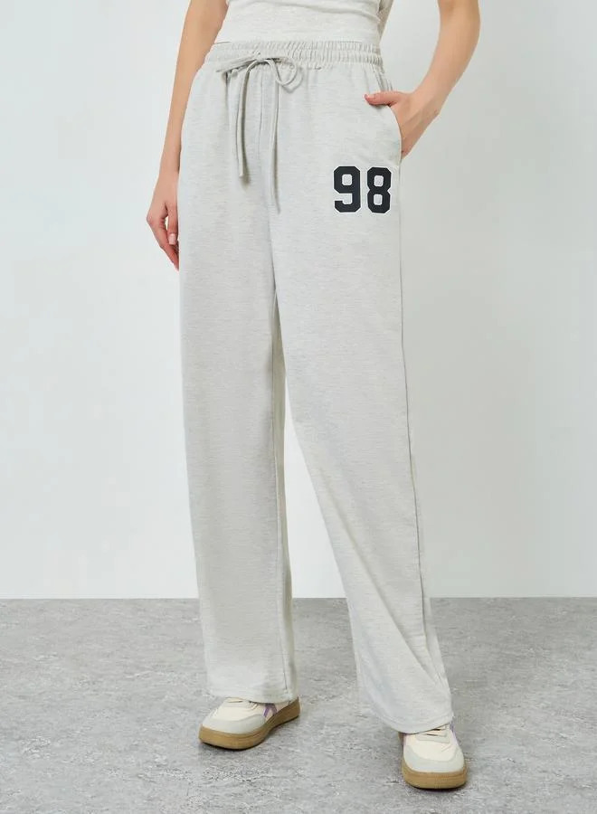 Styli Women Off White Wide Leg Joggers with Drawstring